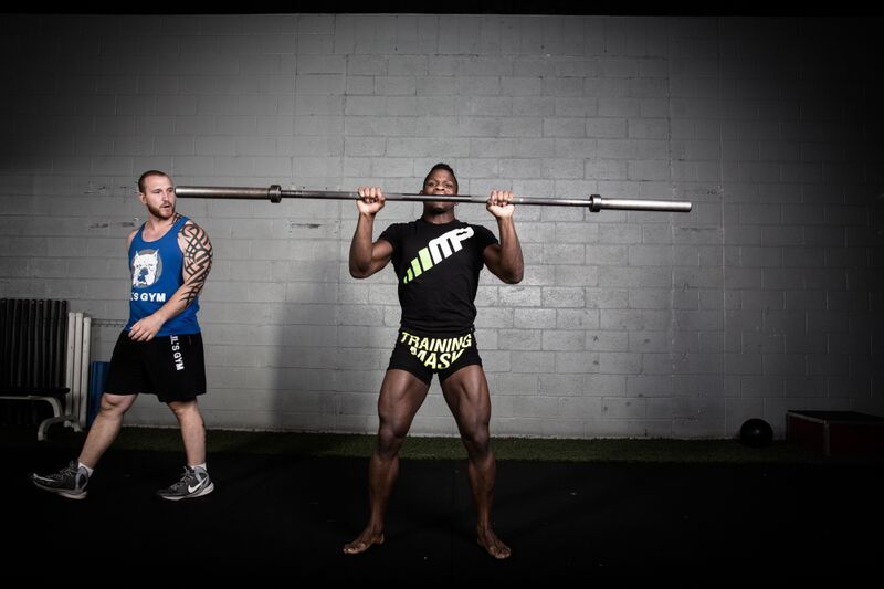 Phil Hawes, professional MMA fighter, training with a barbell