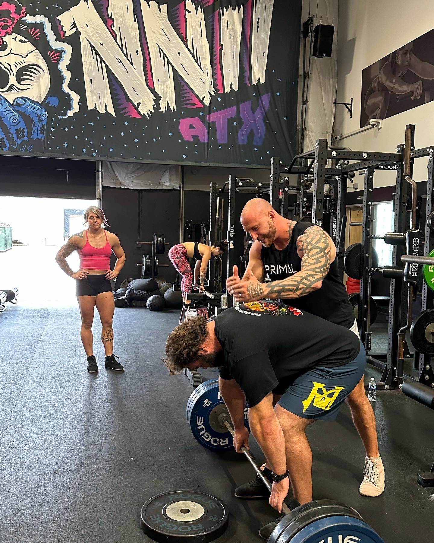 Craig Bongelli coaching a lifter through a deadlift